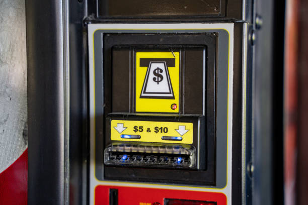Money entry on beverage vending machines. Toronto, Canada - April 30, 2024.