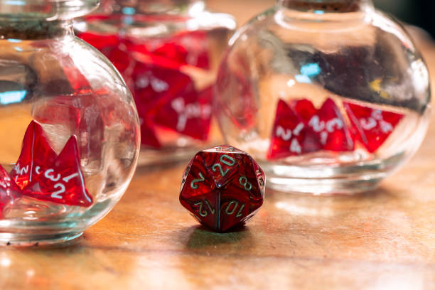 istock A Single Red Dice Stands Out Beside Glass Jars 2151438768