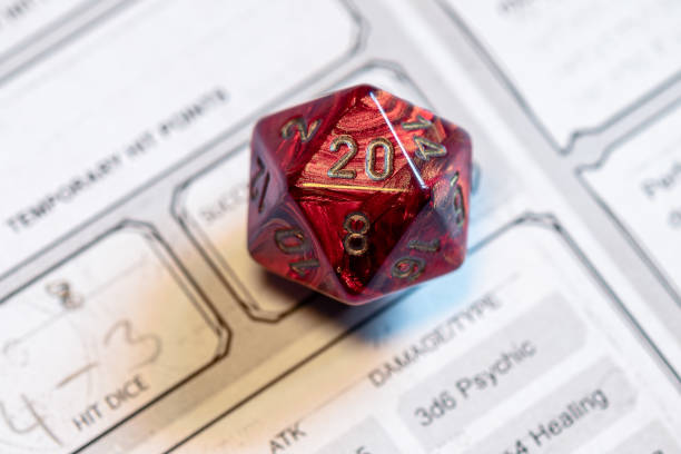 istock Red D20 Dice on Role-Playing Game Character Sheet 2151438780
