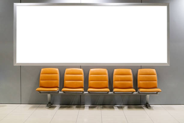 Blank white billboard with text or image in airport with waiting area