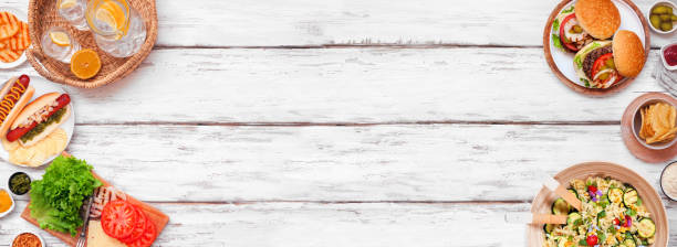 istock Summer BBQ or picnic double border over a white wood banner background 2151445800