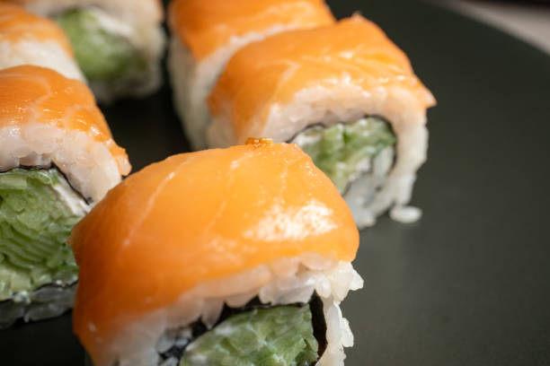 istock Philadelphia roll sushi on a 360 degree rotating table 2151445983