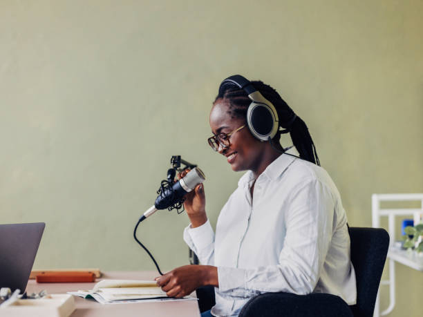 istock Professional Woman Recording Podcast in Studio Setting 2151451911