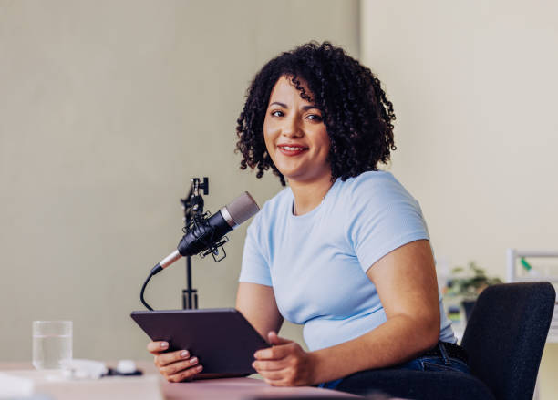 istock Professional Podcaster Recording Episode in Studio with Microphone 2151451926
