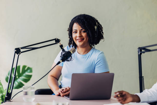 istock Professional Woman Podcasting from a Modern Office Setup 2151451927