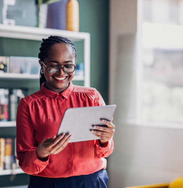istock Two Professional Women Sharing a Tablet in an Office Environment 2151451954