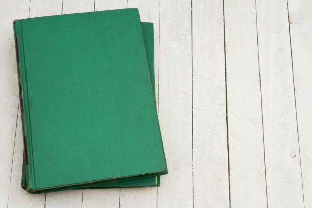 Retro old green book on a desk