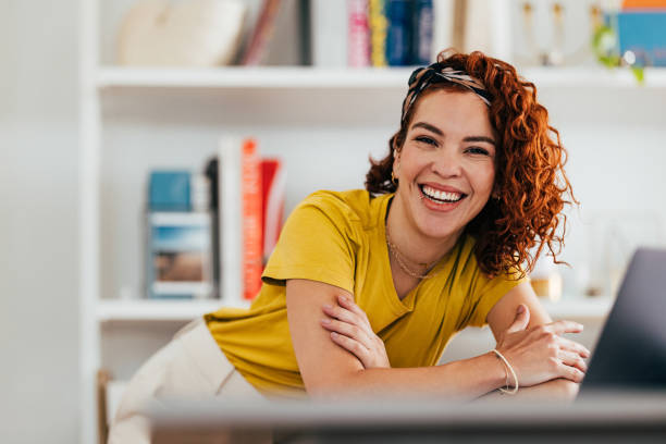 istock Happy Woman Relaxing at Home Office with Bright Smile 2151453379