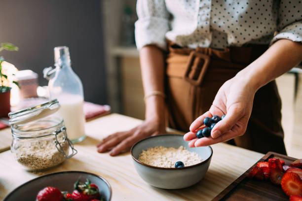 istock Healthy Breakfast Preparation with Fresh Berries and Oats 2151453404