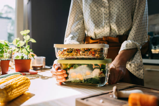 istock Healthy Home Cooking: Woman Preparing Fresh Vegetarian Dishes 2151453443
