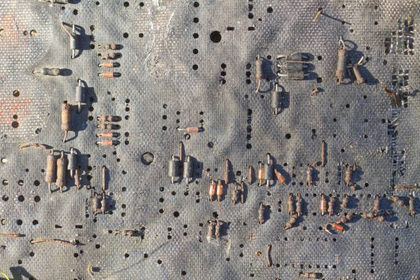 part of a black old microcircuit board with small gray brown details