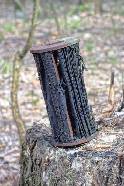 istock one old black brown car filter made of paper and rusty iron 2151466818