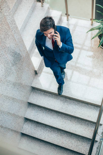 istock Cheerful businessman talking on the phone 2151475415