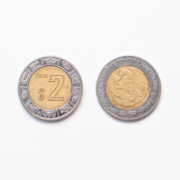 istock Two Mexican peso coin on white background 2151479841