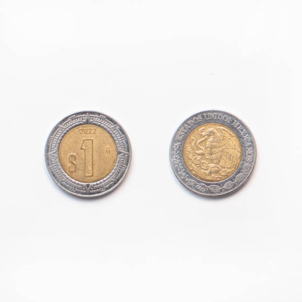 istock Mexican one peso coin from both sides on white background 2151479900