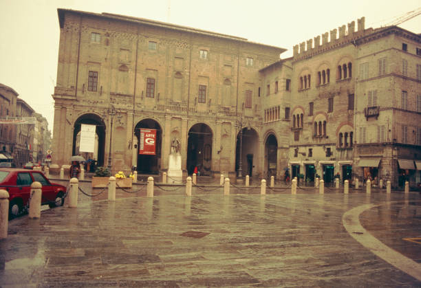 Parma, Emilia-Romagna, Italy, 1 November 1993: on the south-eastern side of Piazza Garibaldi the Palazzo del Comune and the Palazzo del Capitano del Popolo with the characteristic battlements