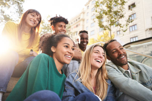 istock Happy smiling multiethnic group friends having fun together. Multiracial young colleagues embracing. 2151483600