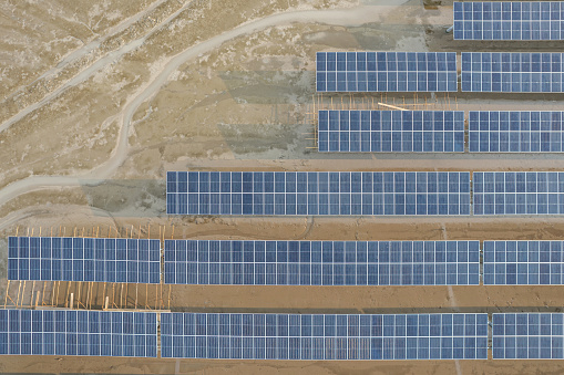 Aerial view of mudflat construction site where photovoltaic solar panels are installed