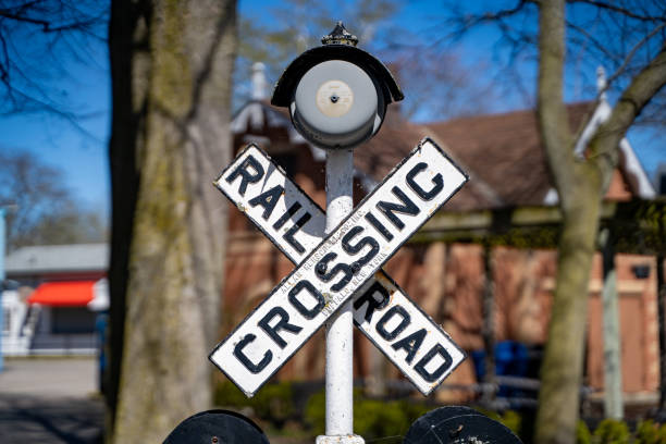 A close-up view of the historic street signs at the intersection of Congress Avenue and East 9th Street in downtown Austin, Texas. These vintage-style black signs mark the heart of the Congress Avenue Historic District, a vibrant area known for its cultural landmarks, shops, and restaurants. The weathered metal pole and urban surroundings add character to the scene, highlighting Austin’s blend of history and modernity.