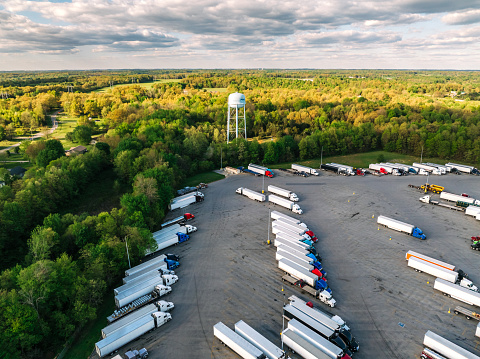 High Angle View of a Truck Rest Stop Surrounded by a Forest of Green Trees near Glendale and Elizabethtown, Kentucky, USA