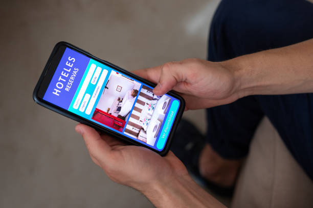 istock Unrecognizable person reviewing hotels online, using smartphone 2151496286