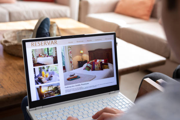 istock Unrecognizable person reviewing hotels online, using laptop 2151496331