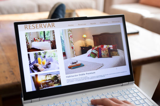 istock Unrecognizable person reviewing hotels online, using laptop 2151496336