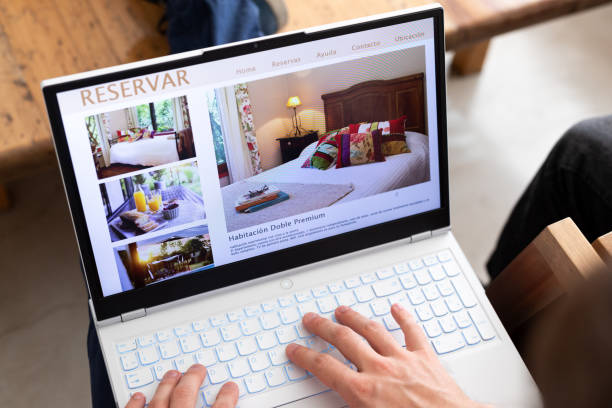 istock Unrecognizable person reviewing hotels online, using laptop 2151496338