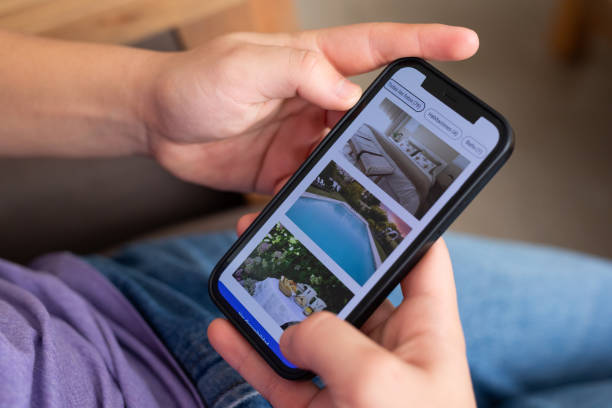 istock Unrecognizable person reviewing hotels online, using smartphone 2151496379