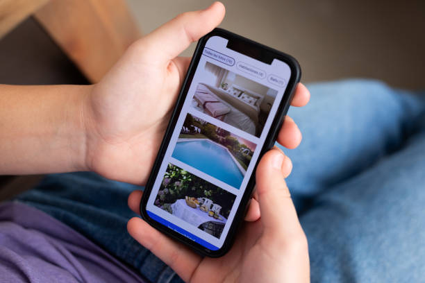 istock Unrecognizable person reviewing hotels online, using smartphone 2151496384