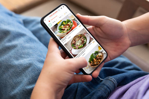 istock Unrecognizable person ordering food using smartphone 2151496392