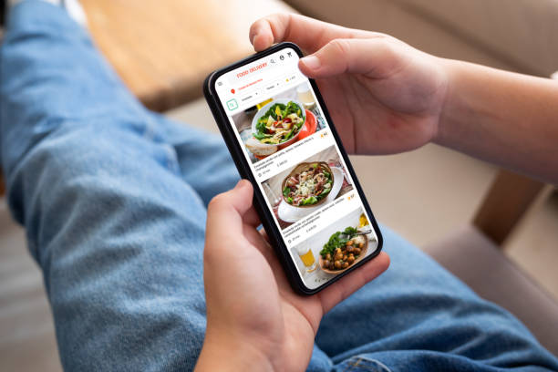 istock Unrecognizable person ordering food using smartphone 2151496396