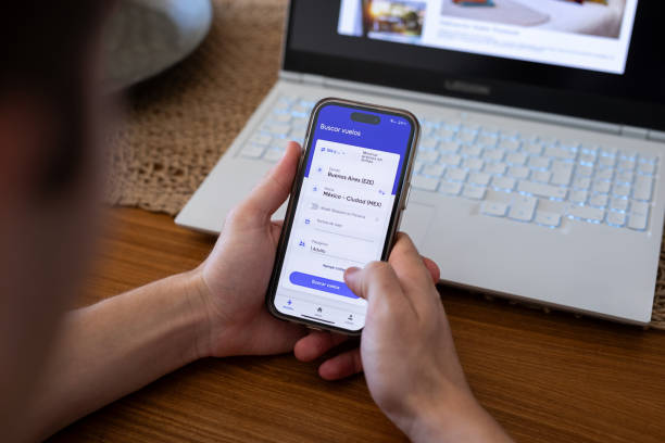 istock Unrecognizable person searching for flights using mobile phone 2151496441
