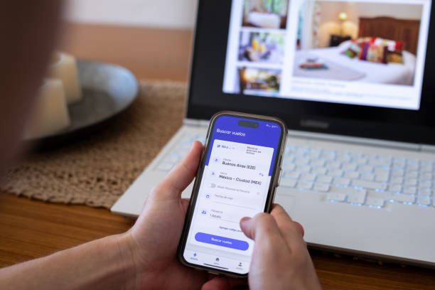 istock Unrecognizable person searching for flights using mobile phone 2151496442