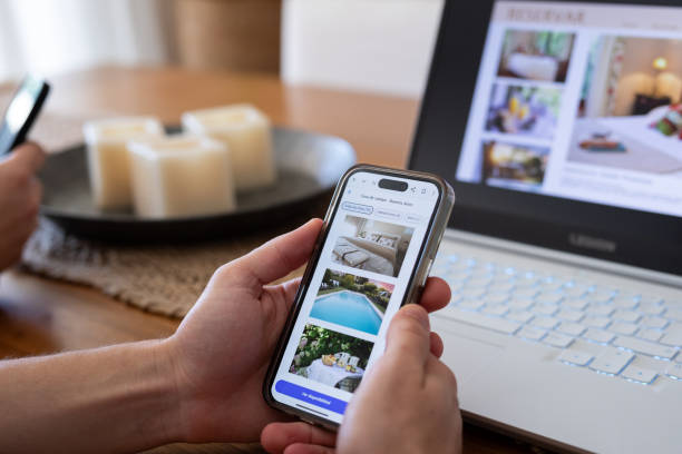 istock Unrecognizable person reviewing hotels online, using smartphone 2151496959