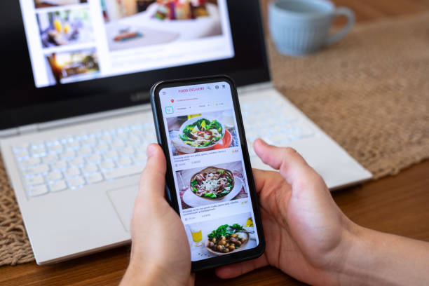 istock Unrecognizable person ordering food using smartphone 2151496966