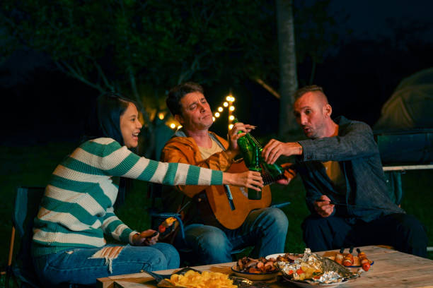 istock Group of People having dinner together at camp. 2151497640