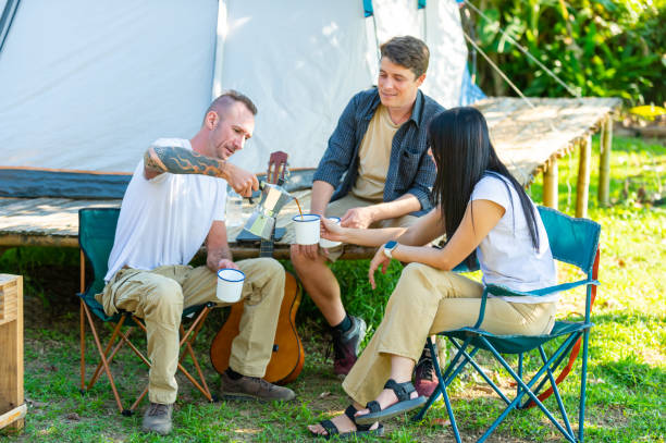 istock Group of Diversity people drinking coffee during camping together at forest mountain. 2151497683