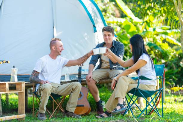 istock Group of Diversity people drinking coffee during camping together at forest mountain. 2151497686