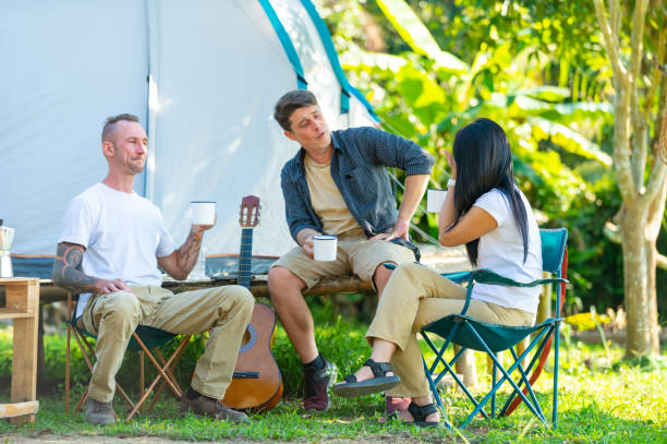 istock Group of Diversity people drinking coffee during camping together at forest mountain. 2151497695