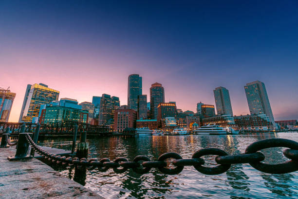 istock Heavy Chain along the Boston Harbor with a Vibrant-Colored Sunset Hazy Sky 2151497859