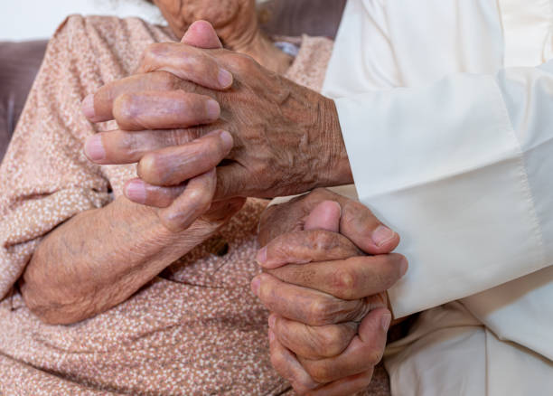 istock Closeup of elderly couple holding hands 2151499851