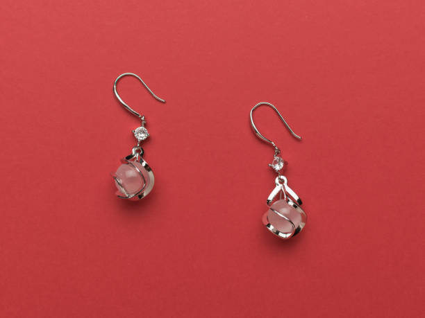 istock Original women's earrings with stones on a red background. 2151503581