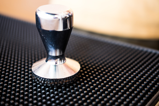Close up of coffee tamper. Selective focus