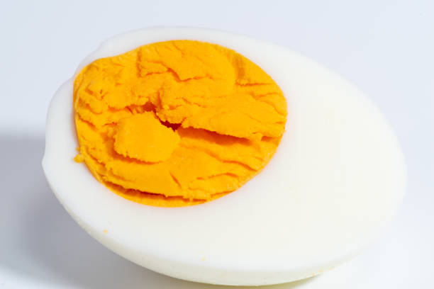Piece of boiled egg. Isolated over white
