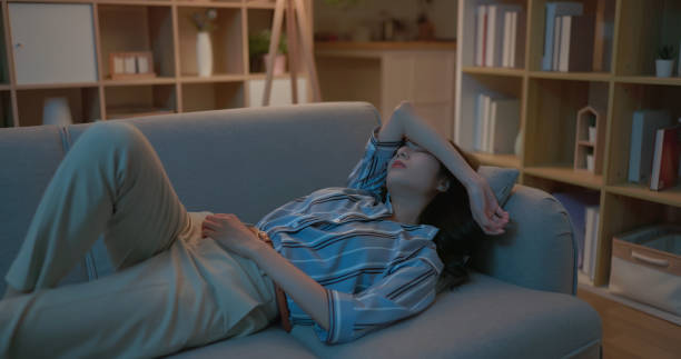 asia businesswoman tired lying sofa - 眠い 日本人 女性 ストックフォトと画像