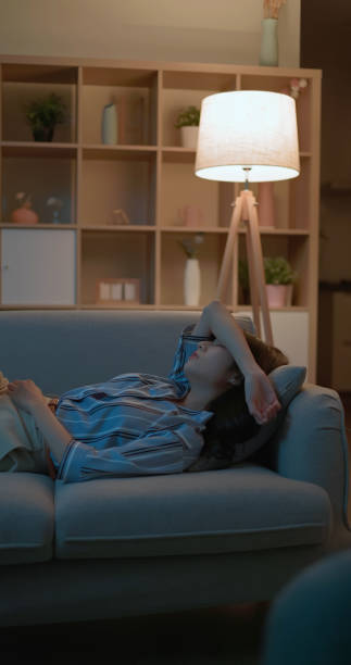 istock asia businesswoman tired lying sofa 2151509904