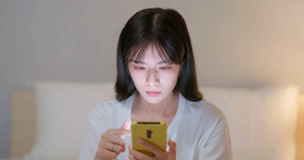 istock woman use smartphone at night 2151510548
