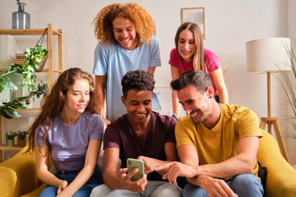 istock Group of young teenagers watching something funny on mobile screen. 2151514924