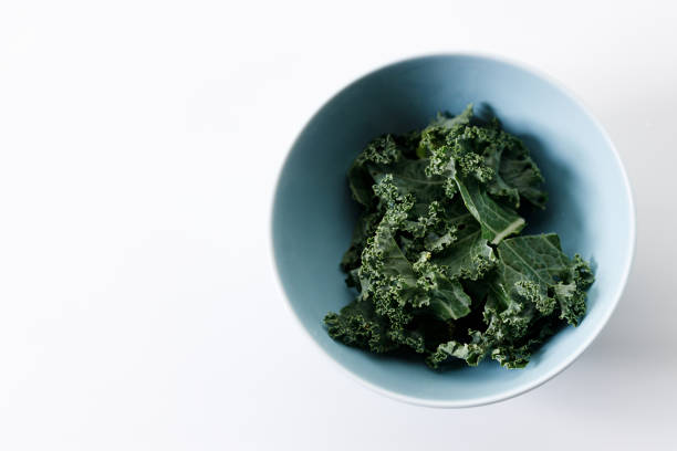 istock Fresh green Kale leaf salad vegetable on white background 2151516804